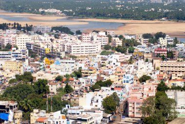 Aerial view of congested multistoreyed buildings of city situated on the banks of river Cauvery ; Tiruchirappalli ; Trichy ; Tamil Nadu ; India clipart