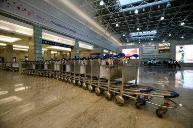Upgraded baggage claim area with newly launched trolleys at International terminal of Chhatrapati Shivaji Maharaj Airport ; Bombay Mumbai ; Maharashtra ; India clipart