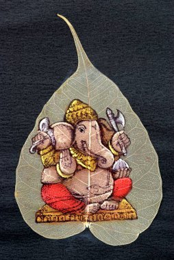 Painted ganesh ganpati on dried leaf of pipal ; Maharashtra ; India clipart