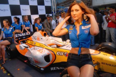 Models display F1 car, Bombay Mumbai, Maharashtra, India    clipart