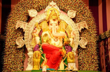 Lord Ganesh Decorated with Gold Ornament Gaur Saraswat Brahmin Mumbai Maharashtra India Asia clipart