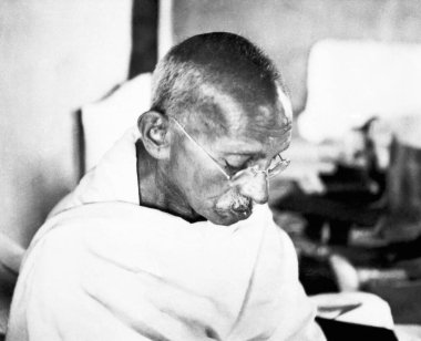 Mahatma Gandhi in his hut at Sevagram Ashram, 1944    clipart