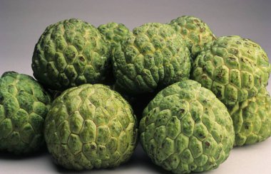 Ripe and fresh custard apples on the table clipart