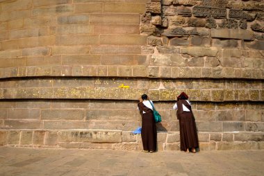 Bhikkhunis female monastic pray at Dhamekh stupa ; Sarnath ; Varanasi ; Uttar Pradesh ; India clipart
