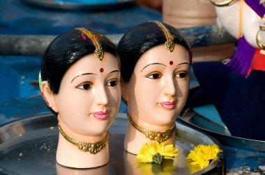 Idols of gauri kept for immersion at pune, Maharashtra, India  clipart