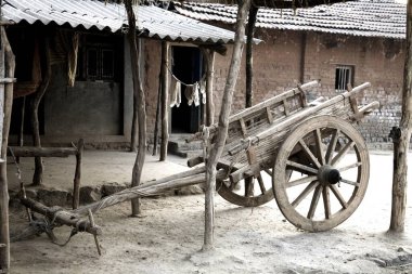 Bullock cart standing at rural house ; Karjat ; Maharashtra ; India clipart