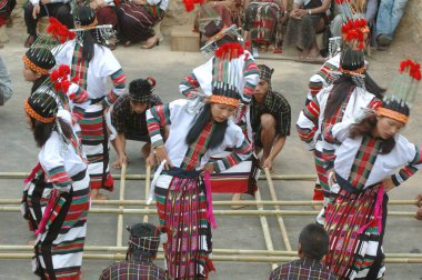 People performing Cheraw bamboo dance Aizwal; Mizoram; India clipart