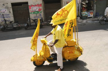 Telugu Desam party worker campaign during assembly election at Hyderabad, Andhra Pradesh, India 2004   clipart