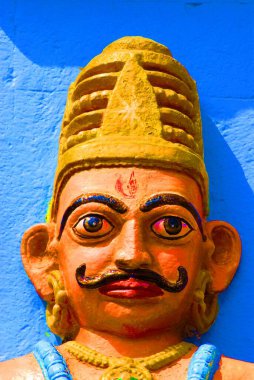 Ashtavinayak, colorful face of a mace bearer at the entrance of Shri Vighneshwar Vinayak Temple, built in 1833 at Ozar, Taluka Junnar, District Pune, Maharashtra, India  clipart