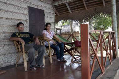 Couple sitting in keraleeyam heritage home and ayurvedic resort  clipart