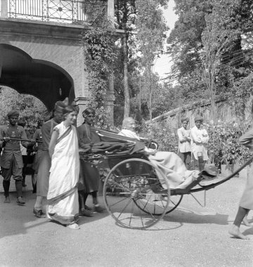 Rajkumari Amrit Kaur and Mahatma Gandhi at their arrival at Simla, 1939, India   clipart