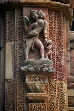 Female statue carved on Rajarani temple, Bhubaneswar, Orissa, India  clipart