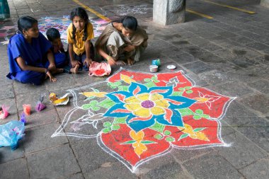 Kolam auspicious art of decorating courtyard of temple, Tamil Nadu, India clipart