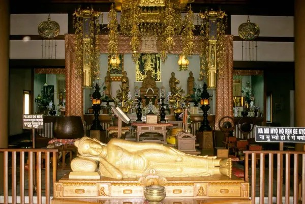 stock image sandal wood statues of buddha in horinji japanese temple, sarnath, uttar pradesh, india 