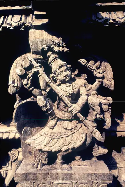 stock image Subrahmanya on peacock wooden carving statues in old temple chariot at Madurai, Tamil Nadu, India 