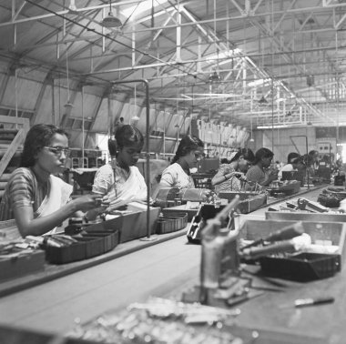 Women working in the telephone factory, manufacturing of telephone instruments at Bangalore, Karnataka, India, year 1950   clipart
