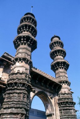 shaking minaretes at siddi bashir mosque ; ahmedabad ; gujarat ; india clipart