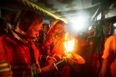 Eunuch followers praying before goddess Yellama ; wedding of eunuchs on occasion of Bewa Purnima at Ghatkopar ; Bombay now Mumbai ; Maharashtra ; India clipart