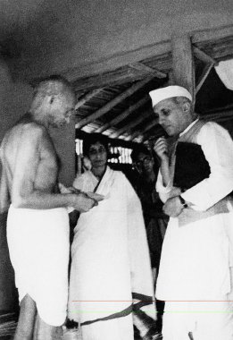 Mahatma Gandhi with Jawaharlal Nehru and Rajkumari Amrit Kaur at Sevagram Ashram, 1940    clipart