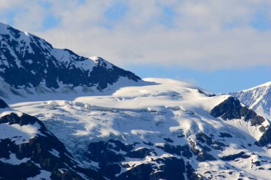 Snowcapped mountains near Hubbard glacier; The longest tidewater glacier in Alaska ; Saint Elias  national park ; Disenchantment bay ; Alaska ; U.S.A. United States of America clipart