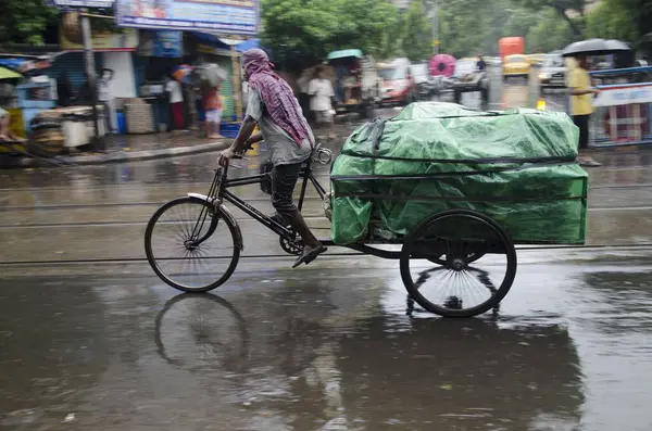 stock image man riding tricycle with luggage on street in Kolkata at West Bengal India Asia 