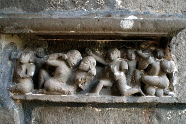 Erotic carving on wall of Bhuleshvar temple, Taluka Purander, District Pune, Maharashtra, India  clipart