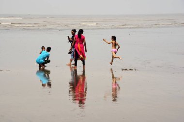 Tourists enjoying, Ubharat beach, Navsari, Gujarat, India, Asia  clipart