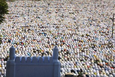 Crowd offering their Eid al Fitr or Ramzan id namaaz at Lashkar-e-Eidgaah ground, Malegaon, Maharashtra, India  clipart