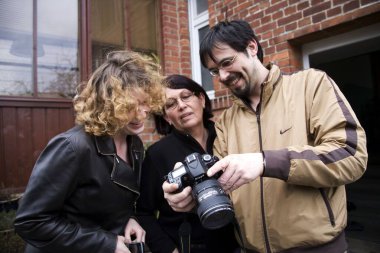 People watching photographs, Salzwedel, Germany, Europe  clipart