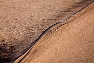Creative curve and form sand pattern texture fine art photography ; Aksa beach ; Malad ; Bombay Mumbai ; Maharashtra ; India clipart