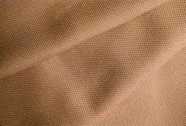 Buruşuk kahverengi kumaşın soyut dokusu