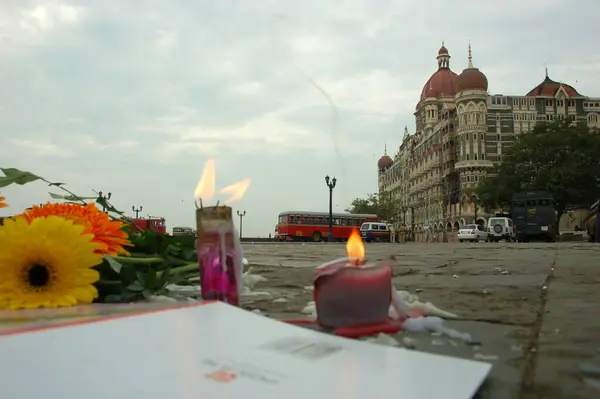 stock image Flowers and candles outside taj mahal hotel after terrorist attack by deccan mujahideen ; Bombay Mumbai ; Maharashtra ; India 26-November-2008