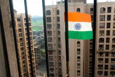 paper flag at a window on Independence day in sagar city, Andheri, Bombay Mumbai, Maharashtra, India  clipart