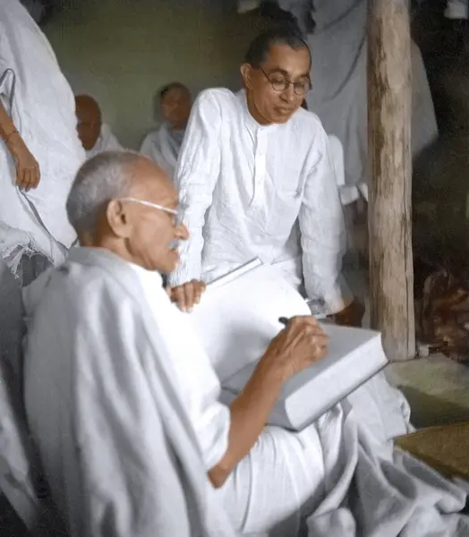 stock image Mahatma Gandhi with Pyarelal Nayyar in hut, Wardha, Maharashtra, India, Asia, 1939