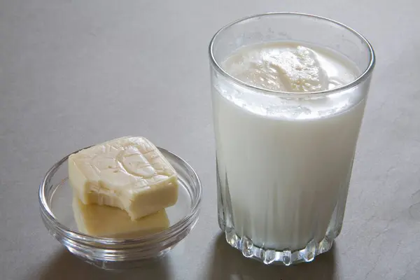 Full glass of milk and cheese made from milk dairy product , India