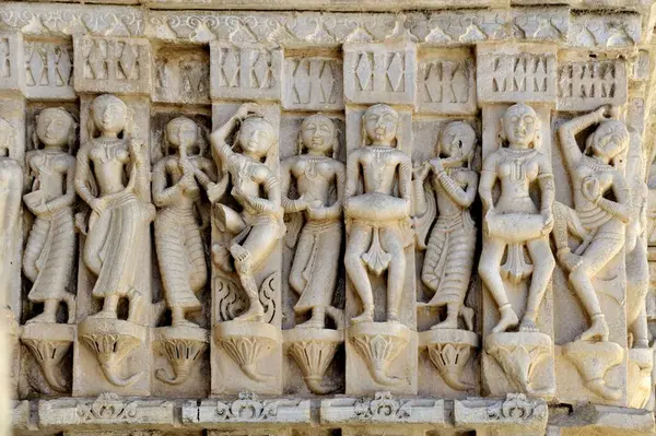 stock image carving of woman dancers Jagdish temple in udaipur at rajasthan india Asia