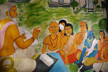 Sandipani Rishi Ashram 'ın duvarında resim, Tanrı Krishna' nın resim yapmaya geldiği yer, mavi renkli çocuk Krishna ve arkadaşları guru öğretirken, Ujjjain, Madhya Pradesh, Hindistan 