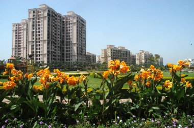 Bhakti park garden in front of high rise residential complex in Wadala east, Bombay Mumbai, Maharashtra, India  clipart