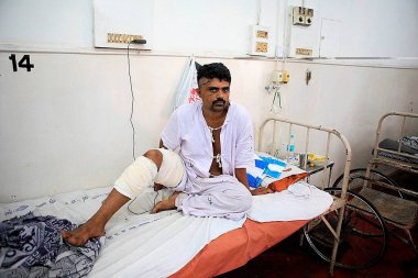 Abdul rashid injured citizen recovering at JJ hospital during recent bomb blasts on 26th November 2008 in  Bombay Mumbai, Maharashtra, India   clipart