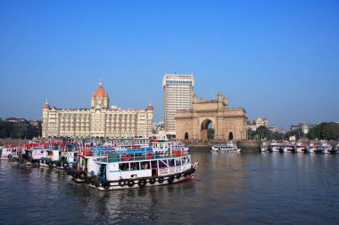 Gateway of India and Taj Mahal Hotel ; ferryboats in sea ; Bombay Mumbai ; Maharashtra ; India clipart