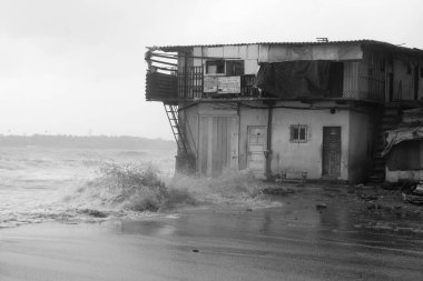 Slum on sea front at Versova beach, Bombay Mumbai, Maharashtra, India  clipart