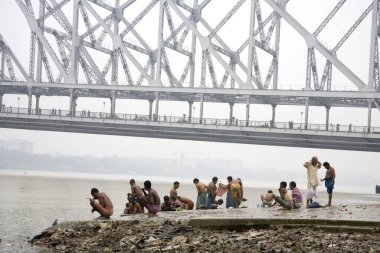 Activities on Babu ghat ; Howrah bridge over Hooghly river in background ; Calcutta now Kolkata ; West Bengal ; India clipart