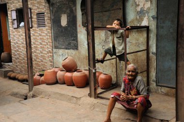 child playing dharavi slum, mumbai, maharashtra, India, Asia clipart
