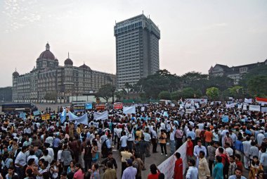 Protester near hotel Taj Mahal after terrorist attack by Deccan mujahedeen in Bombay Mumbai, Maharashtra, India 3-December-2008  clipart