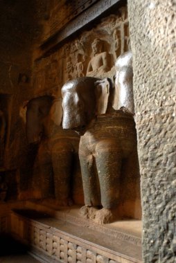 Statue in Buddhist Karla caves finest examples of ancient rock cut caves built in 3rd 2nd century BC by Buddhist monk ; Karla ; Maharashtra ; India clipart