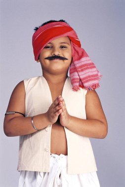 child dressed as Milkman ; boy wearing traditional Indian bhaiya costume doing namaste clipart