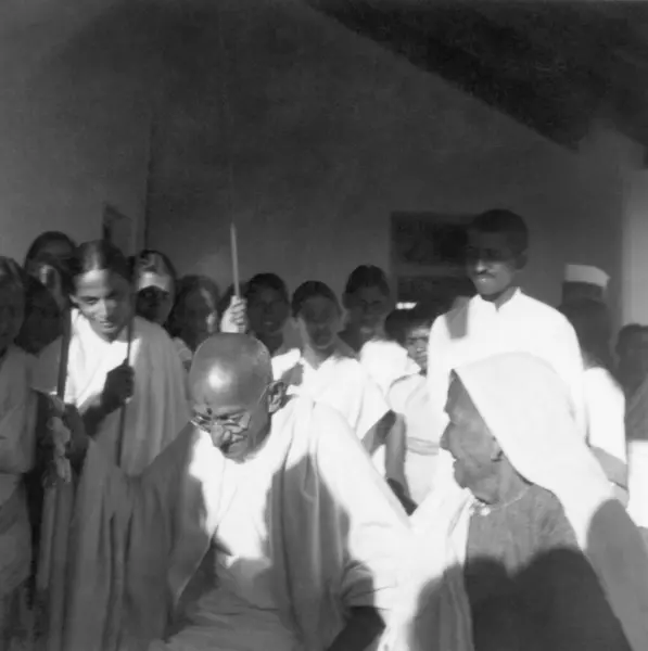 stock image Mahatma Gandhi with the mother of Jamnalal Bajaj and others at Gopuri Wardha, 1945, India  