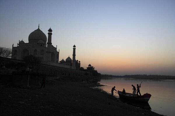 Sunset view of Taj Mahal Seventh Wonders of World on south bank of Yamuna river , Agra , Uttar Pradesh , India UNESCO World Heritage Site