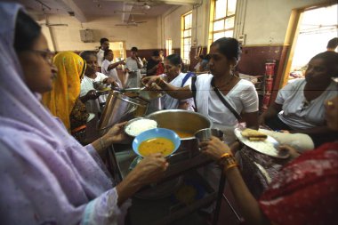Food being served to victims of terrorist attack by Deccan Mujahedeen on 26th November 2008 treated in J.J. hospital in Bombay Mumbai, Maharashtra, India   clipart