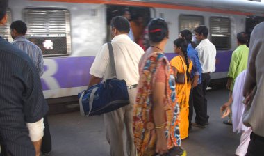Commuters on platform at  Borivali railway station Bombay Mumbai ; Maharashtra ; India clipart